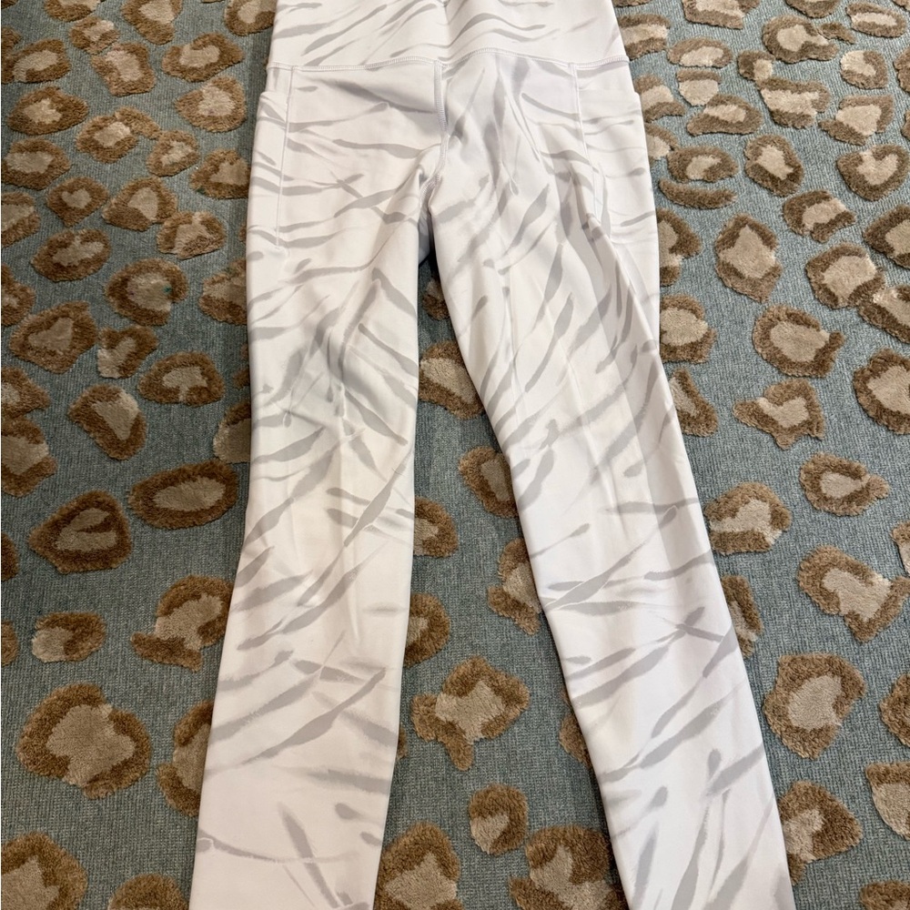 Athleta Cream and Gray Stash Pocket Tights